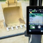 CAT 320 touchscreen monitor with the bucket in view from the cab