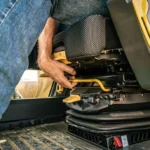 CAT 323 GC operator seat adjustment in the cab
