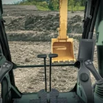 View from the CAT 330 GC cab over the joysticks to the bucket