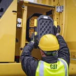 Technician changing the CAT 336 GC air intake filter