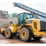 CAT 950 GC Wheel Loader loading aggregate below a conveyor at a gravel plant