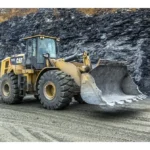 CAT 972L Wheel Loader with a rock bucket at a quarry face