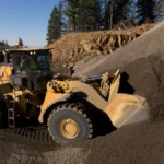 CAT 980 Wheel Loader digging into a gravel stockpile