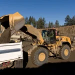 CAT 980 Wheel Loader loading a dump truck at an aggregate plant