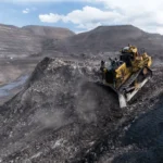 CAT D11 Bulldozer pushing overburden on a mine bench