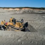 CAT D11 Bulldozer with single-shank ripper in an open-pit mine