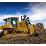 CAT D6 Bulldozer pushing a soil pile, left side view