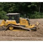 CAT D6 VPAT arrangement grading soil, side view with rear ripper