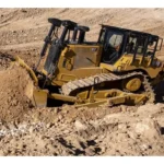 CAT D7 Bulldozer with SU blade pushing rock and soil
