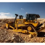 CAT D7 Bulldozer with SU blade and single-shank ripper in a rocky cut