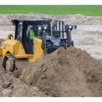 CAT D8 Bulldozer pushing a soil pile, front view