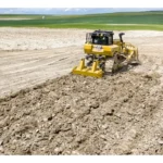 CAT D8 Bulldozer rear view with multi-shank ripper on spread fill